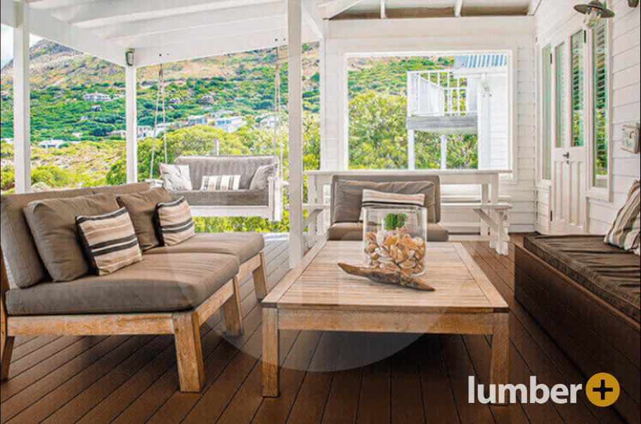 Dark wood raised deck with covered porch and seating area.